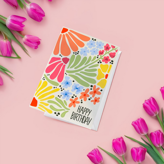 Celebrate a special birthday with this beautifully illustrated spring-themed birthday card! 🌼🌷 Featuring a warm pale yellow background and a stunning arrangement of colorful flowers, this card brings the fresh and joyful energy of spring to any birthday celebration. The dark green "HAPPY BIRTHDAY" text pops against the floral backdrop, making this a perfect choice for anyone who loves bright, cheerful designs.