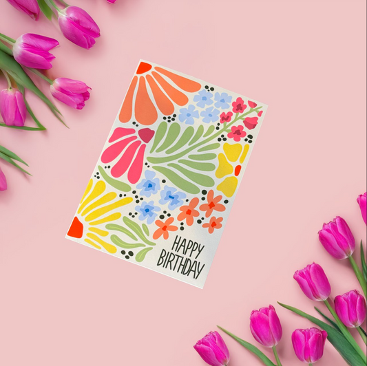 Celebrate a special birthday with this beautifully illustrated spring-themed birthday card! 🌼🌷 Featuring a warm pale yellow background and a stunning arrangement of colorful flowers, this card brings the fresh and joyful energy of spring to any birthday celebration. The dark green "HAPPY BIRTHDAY" text pops against the floral backdrop, making this a perfect choice for anyone who loves bright, cheerful designs.