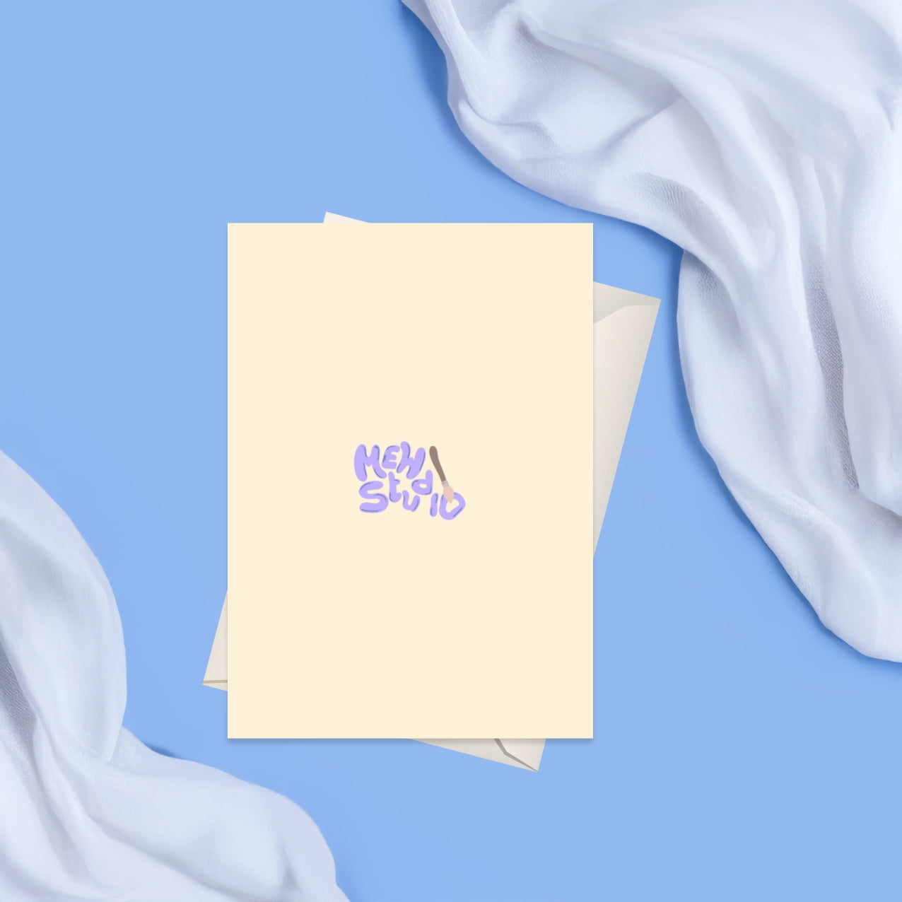 Back of the card with with a beige background and the Mew Studio logo in the middle of the card 